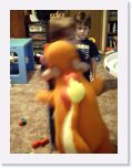 0001 * Danny hugs Charmander while Andy looks on. * 480 x 640 * (154KB)